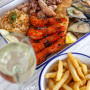 Seafood Platter4 king prawns served with mussels, calamari tubes, beer battered hake, chips and aromatic basmati rice.