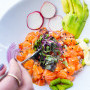 RAINBOW BOWL - SALMON OR TUNA fresh salmon cubes, avocado*, fresh asparagus, red onion, cucumber spirals on a bed of sushi rice with an umami sauce and sesame seeds